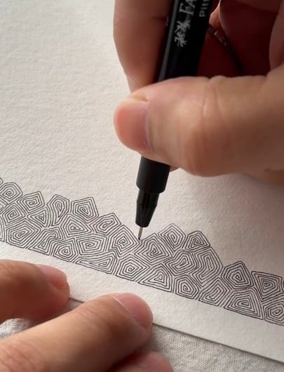 Drawing intricate concentric spirals with a Faber-Castell Pitt Artist Pen