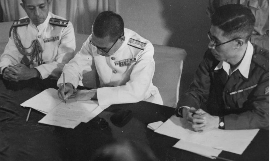 Enemies once friends. A Japanese Rear Admiral surrenders to Britain (1945). He is wearing a distinguished service cross, awarded by Britain for heroism from a time when Britain and Japan were allies.