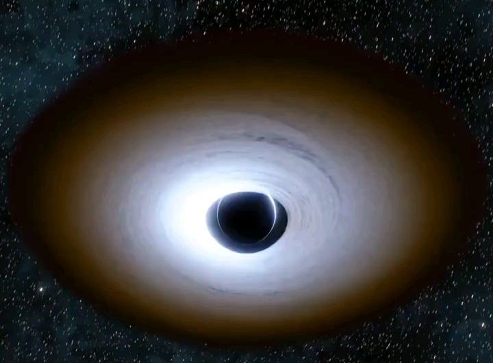 Fascinating visualization of a black hole surrounded by an accretion disk, illustrating how light is warped by its intense gravitational fields.