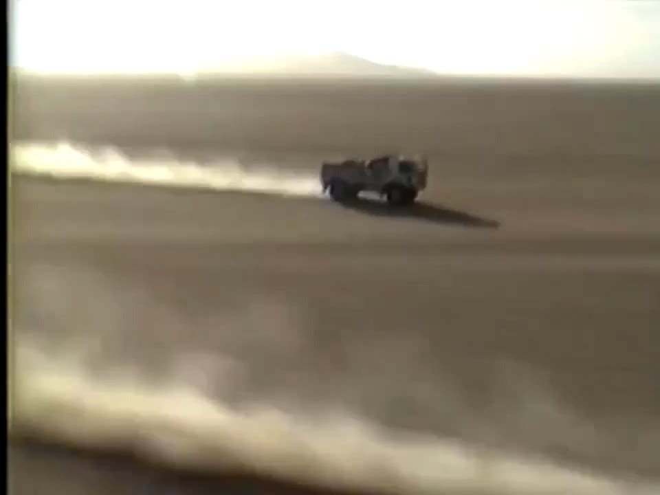 Head-to-head straight-line showdown between a rally truck fitted with two 13L triple-turbo diesel engines and a 400 horsepower Group B rally car with a dry weight of under a ton.