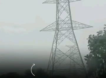 Indian Man's dramatic 300-foot climb on a high-voltage tower draws a crowd.