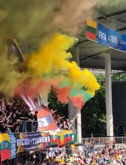 Lithuanian fans with a flag made out of flares during Baltic Cup game against Latvia