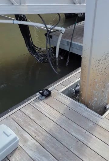 Live electrical wires underwater in the docks