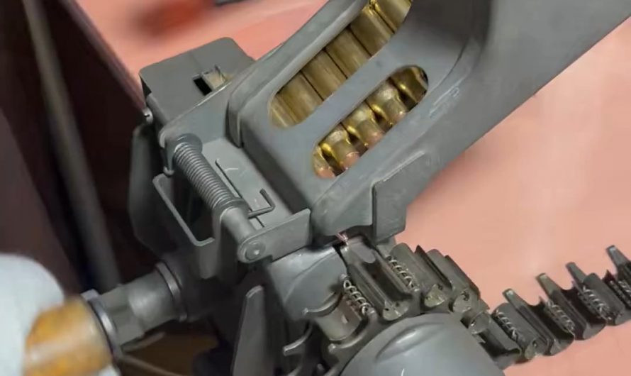 Mechanical reloading of bullets in the ammo belt