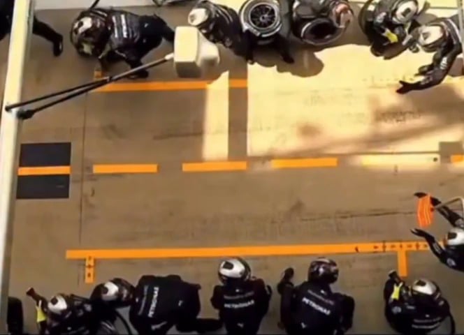 Mercedes' pit crew performing a wheel change in 2 seconds.