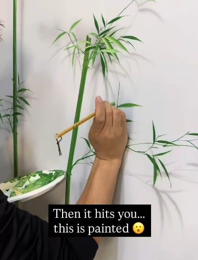 Mural artist Li Sheng creating 3D plant illusions with painted shadows