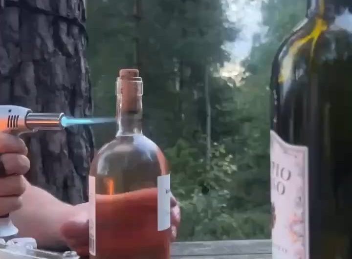 Opening a bottle with fire