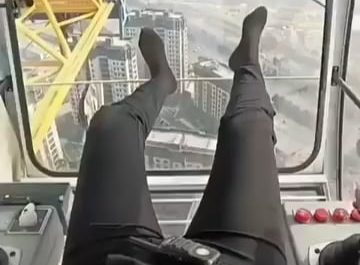 POV: Leaving the cabin of a tower crane after a long shift.