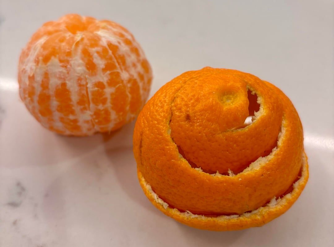 Peeled a tangerine in one piece