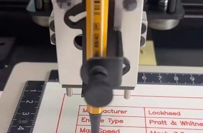 Pen plotter drawing an SR-71 Blackbird with a fine liner pen