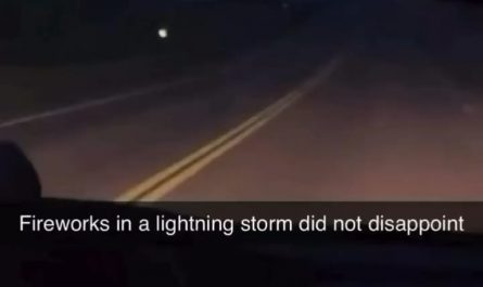 Perfectly timed lightning strike during a fireworks show