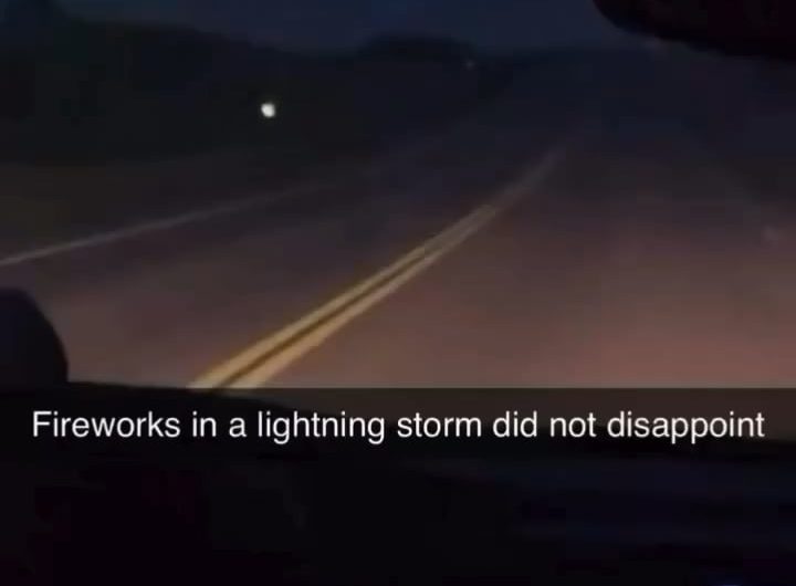 Perfectly timed lightning strike during a fireworks show