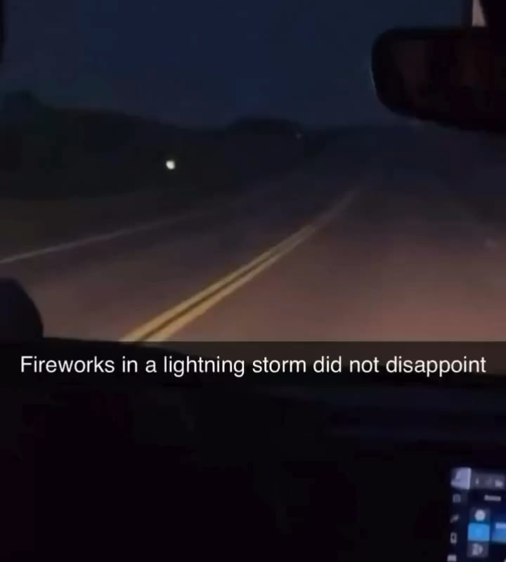 Perfectly timed lightning strike during a fireworks show