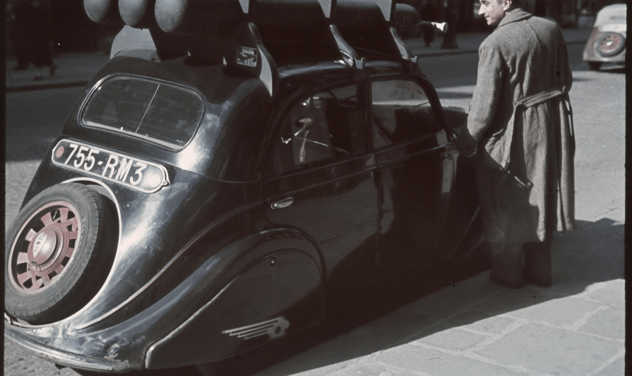 Photo of Peugeot 202 with adaptation to run on natural gas during german ocupation of France. Photo by Andre Zucca, 1940s.