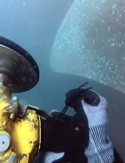 Polishing a ships propeller