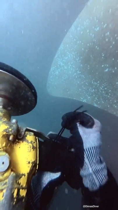 Polishing a ships propeller