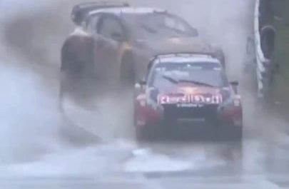 Racecar driver spins out on wet course, but smoothly saves it