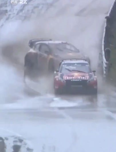 Racecar driver spins out on wet course, but smoothly saves it