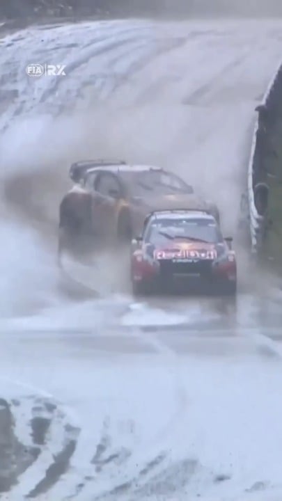Racecar driver spins out on wet course, but smoothly saves it