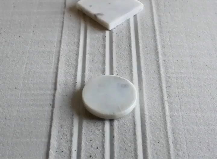 Raking a flawless infinity loop in a Zen garden.