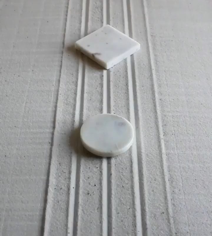 Raking a flawless infinity loop in a Zen garden.