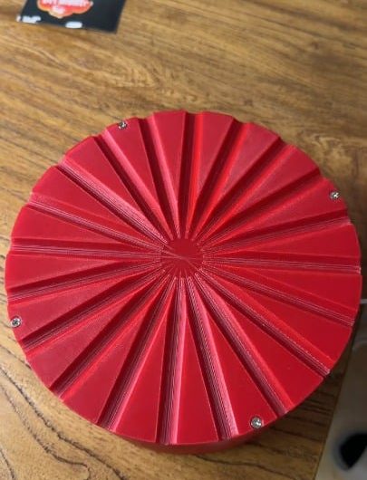 Rolling steel ball bearings into radial channels