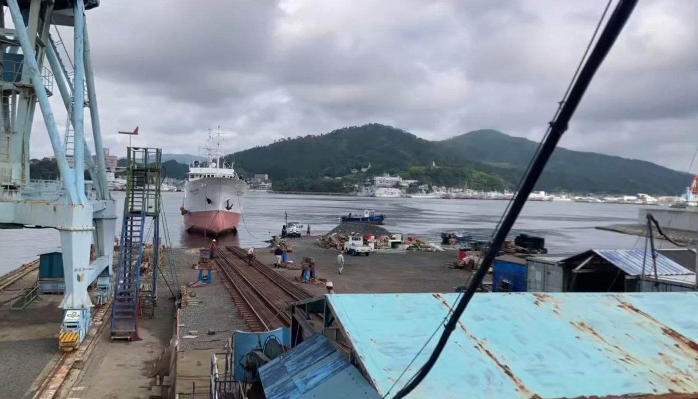 Ship being pulled into a drydock