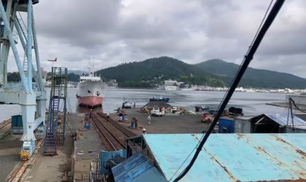 Ship being pulled into a drydock