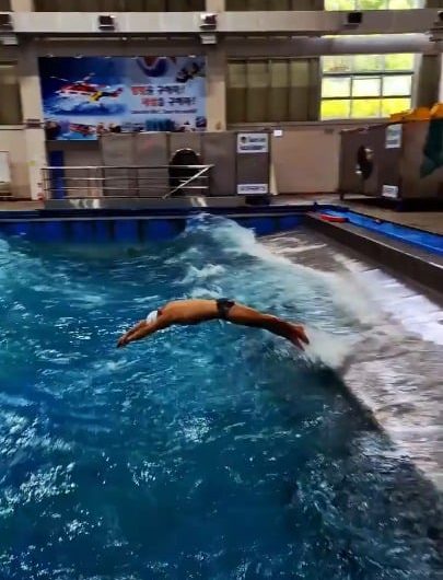 South Korea Coast Guard Academy (KCGA) rescue swimmer training in a wave simulation pool