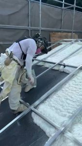 Spraying polyurethane foam for roof insulation