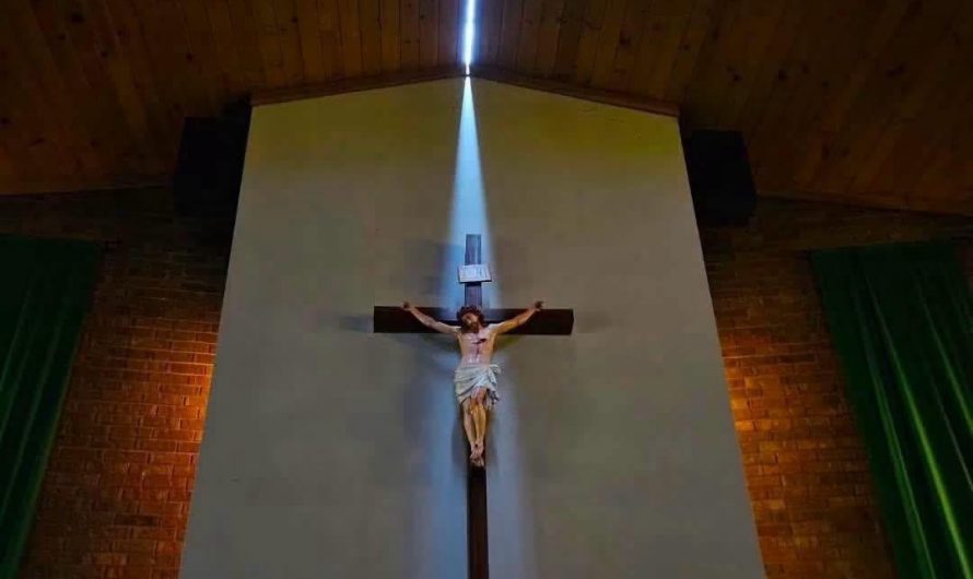 Storms with 131 MPH winds that went through Highmore, SD split the roof of St Mary’s Catholic Church, which allowed sunlight to highlight the church’s crucifix (Photo by Joseph Mat)