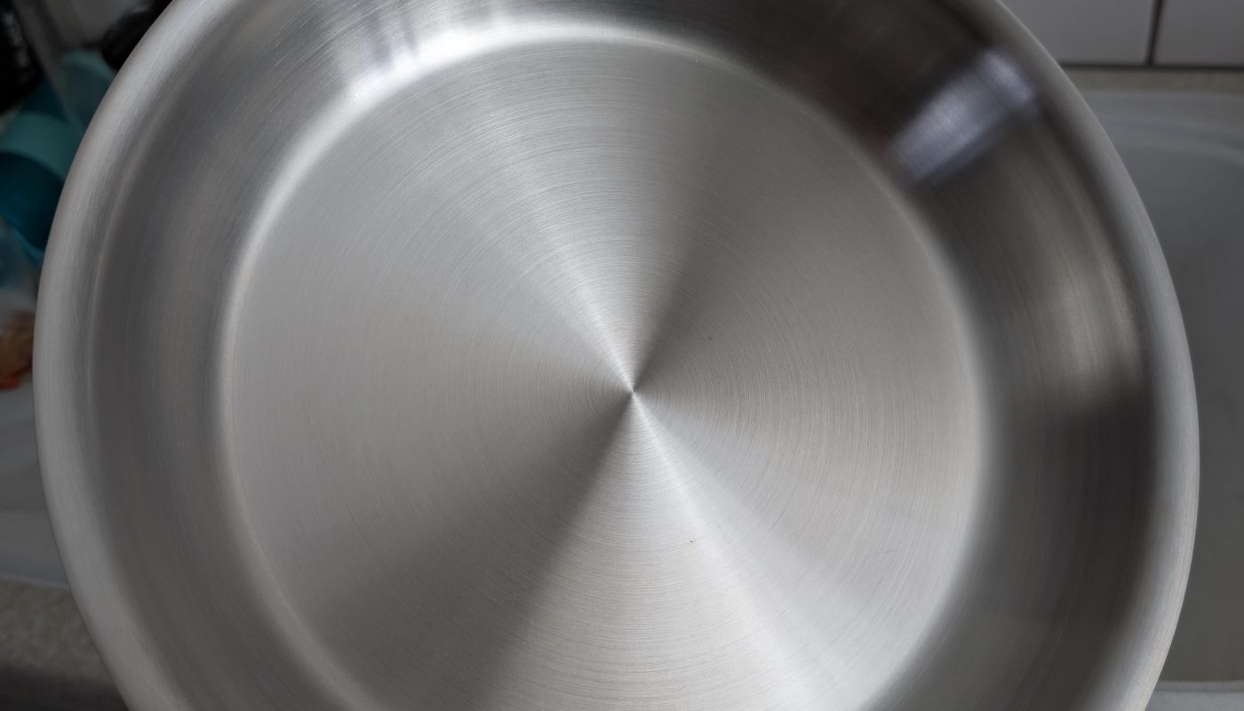The finish on a stainless steel pan