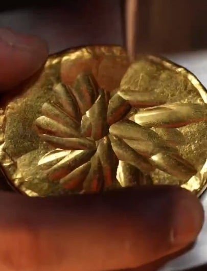 The precise process of hammering, hand-engraving, and detailing a gold cup
