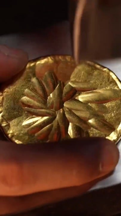The precise process of hammering, hand-engraving, and detailing a gold cup