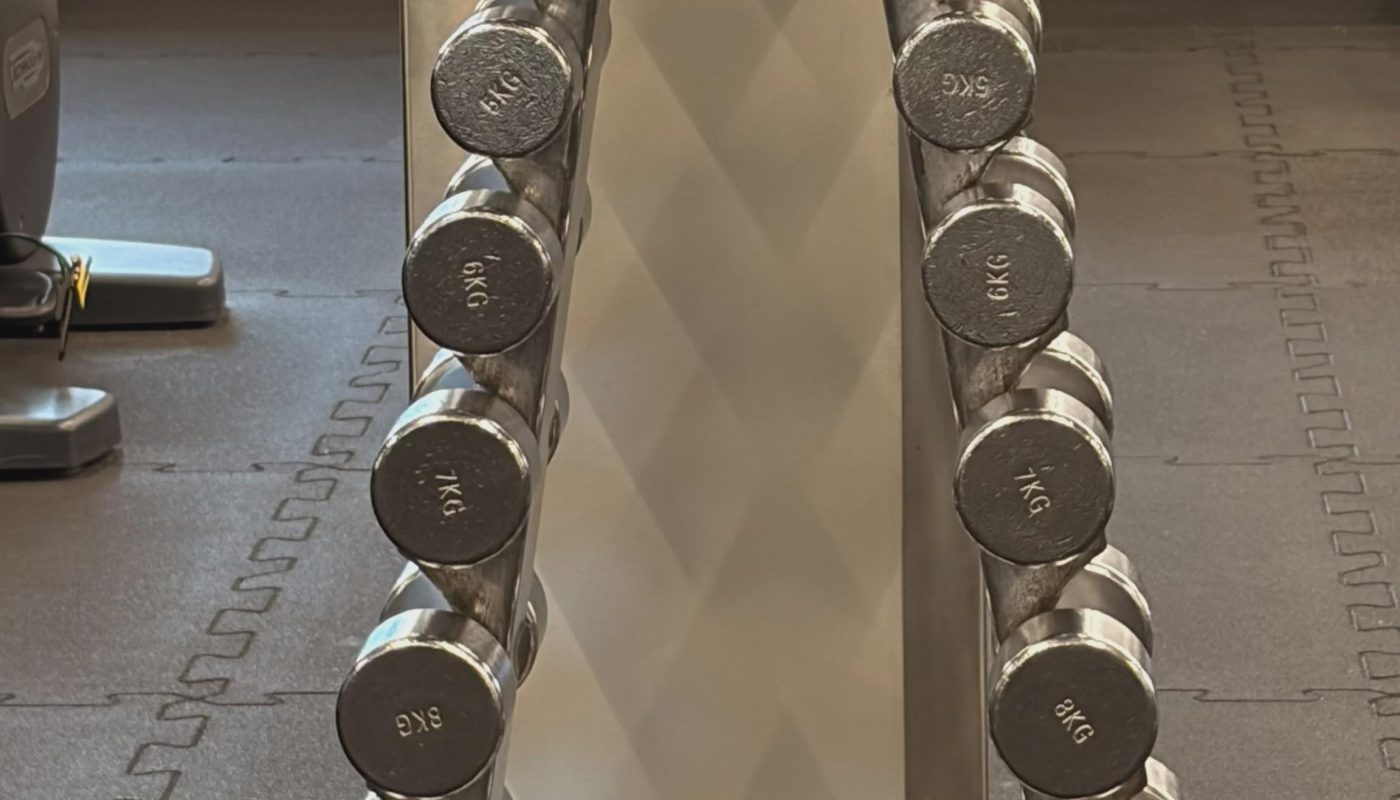 The shadow created by the dumbbell rack