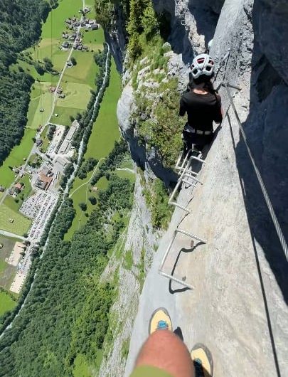 The sheer drop and narrow rebar steps of the Mürren via ferrata trail in Switzerland