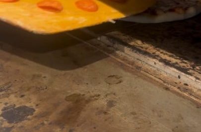 The way he tops the pizza with pepperoni after it's already in the oven
