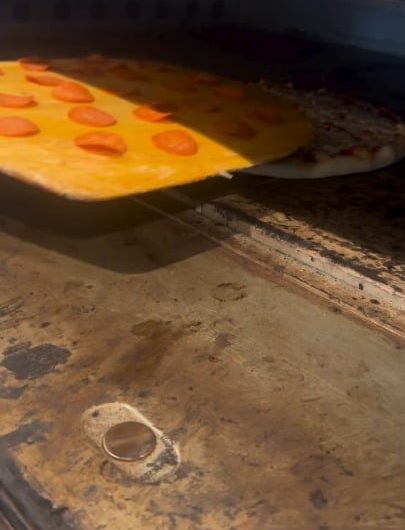 The way he tops the pizza with pepperoni after it’s already in the oven