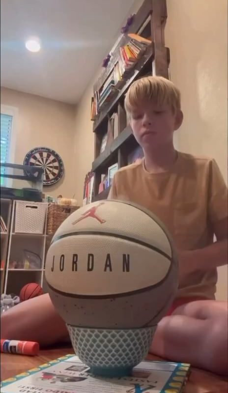 This kid stacked a dice and a fidget spinner on a bottle and still pulled off an insane bottle flip. Level of precision is unreal.