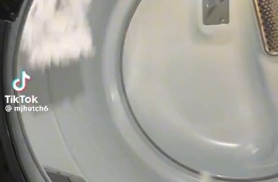 Three mop heads tumble drying(longer descriptive title)