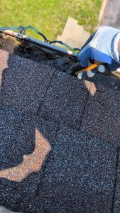 Unclogging my gutters after heavy rains