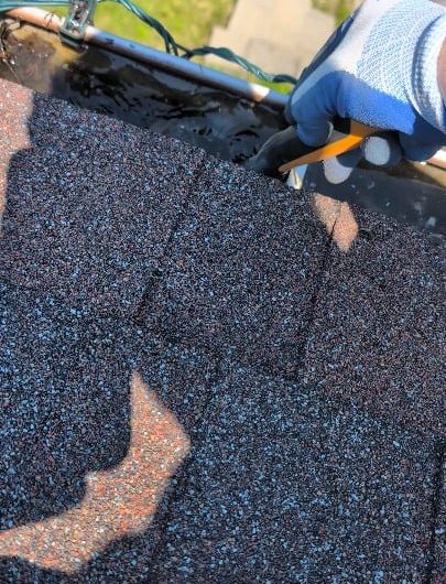 Unclogging my gutters after heavy rains