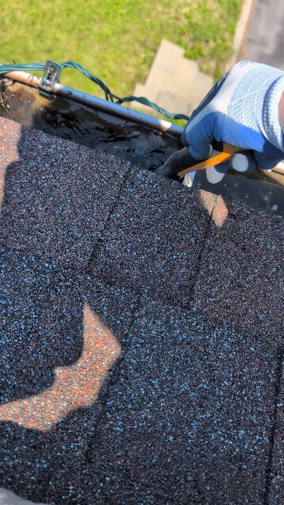 Unclogging my gutters after heavy rains