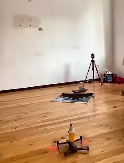 Using a drone to screw in a light bulb