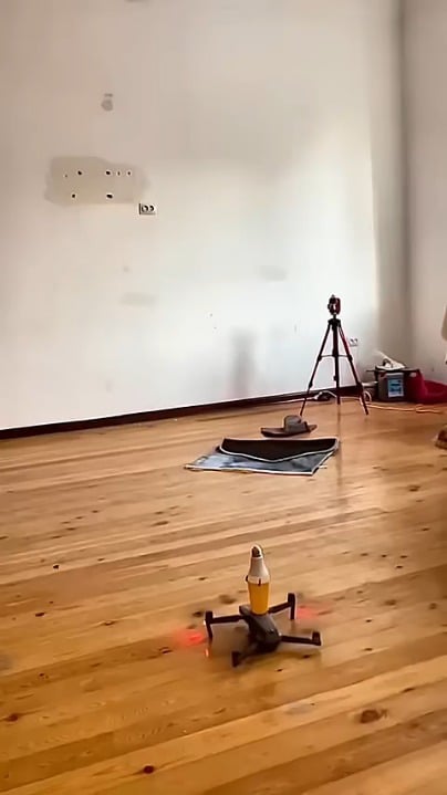 Using a drone to screw in a light bulb