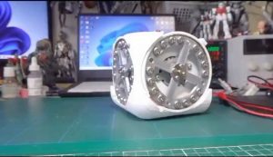 Using a reaction wheel, this system can lift itself upright and maintain balance in an inverted position.