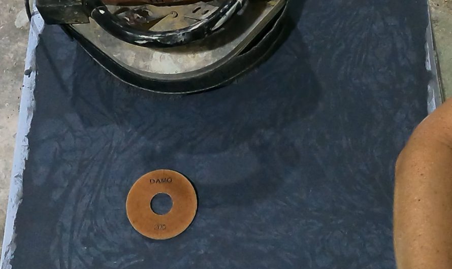 Wet grinding a concrete table top to expose and polish an intricate inlay – OC