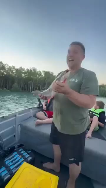 When a man notices an eagle eyeing the fish he just caught