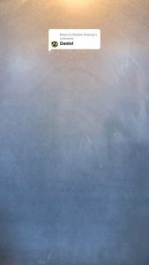Writing the name "Daniel" out of fine marble dust using a utility blade