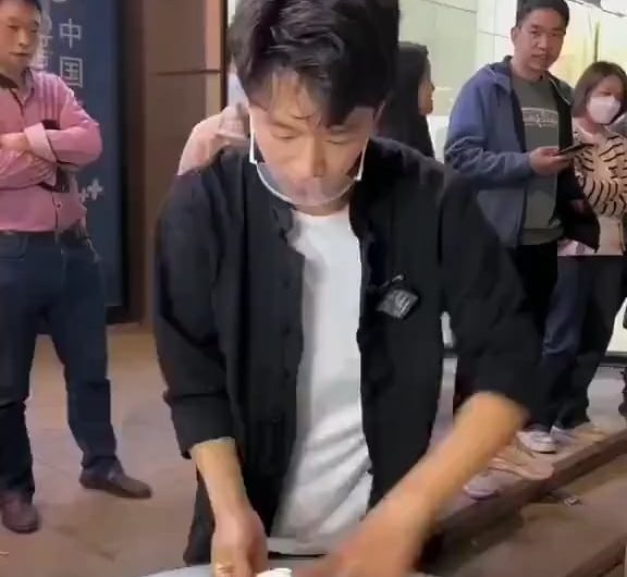 this cook is showing some serious acrobatic skills